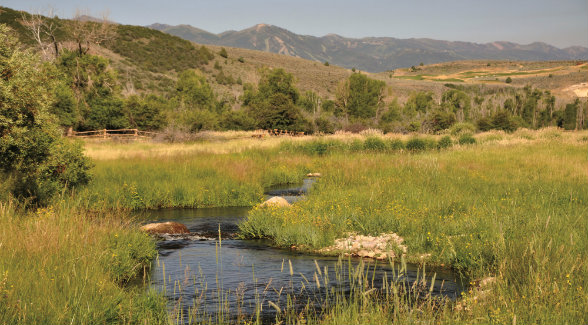Deer Valley looms in the distance of Utah's Freestone River Ranch.